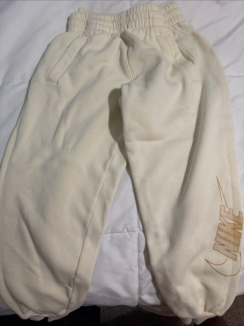 Nike Cream Sweatpants with Gold Logo Accent